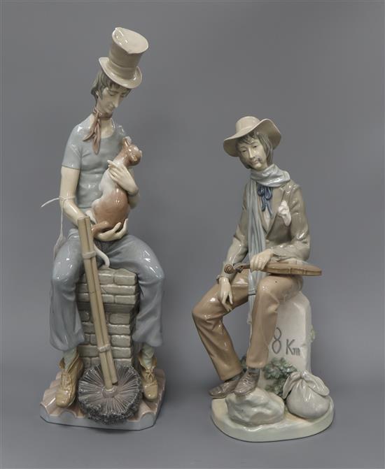 Two Lladro figures, a man with a cat and a man with a violin tallest 44cm